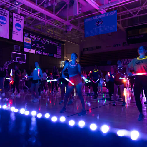 Monster Mash dance event in arena with glow lights